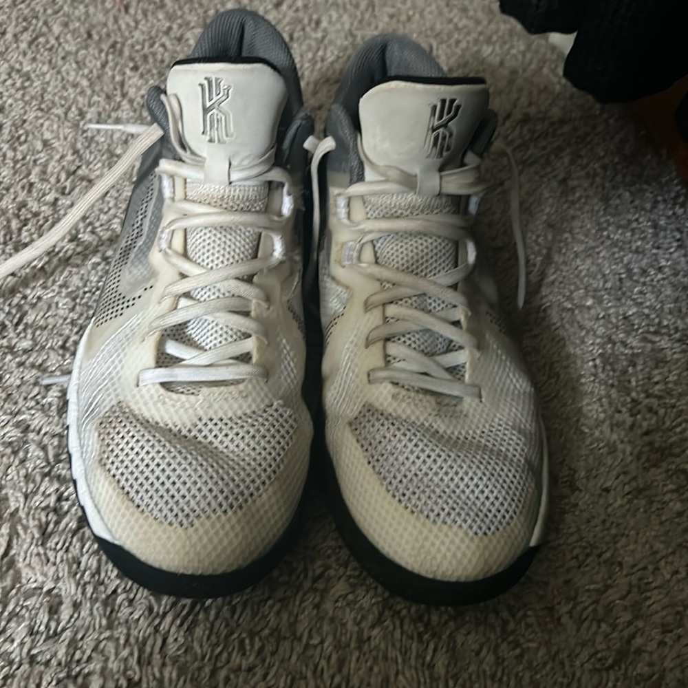 Kyrie 11/23 boys youth size 7 basketball shoes. Very worn in but still useable.
